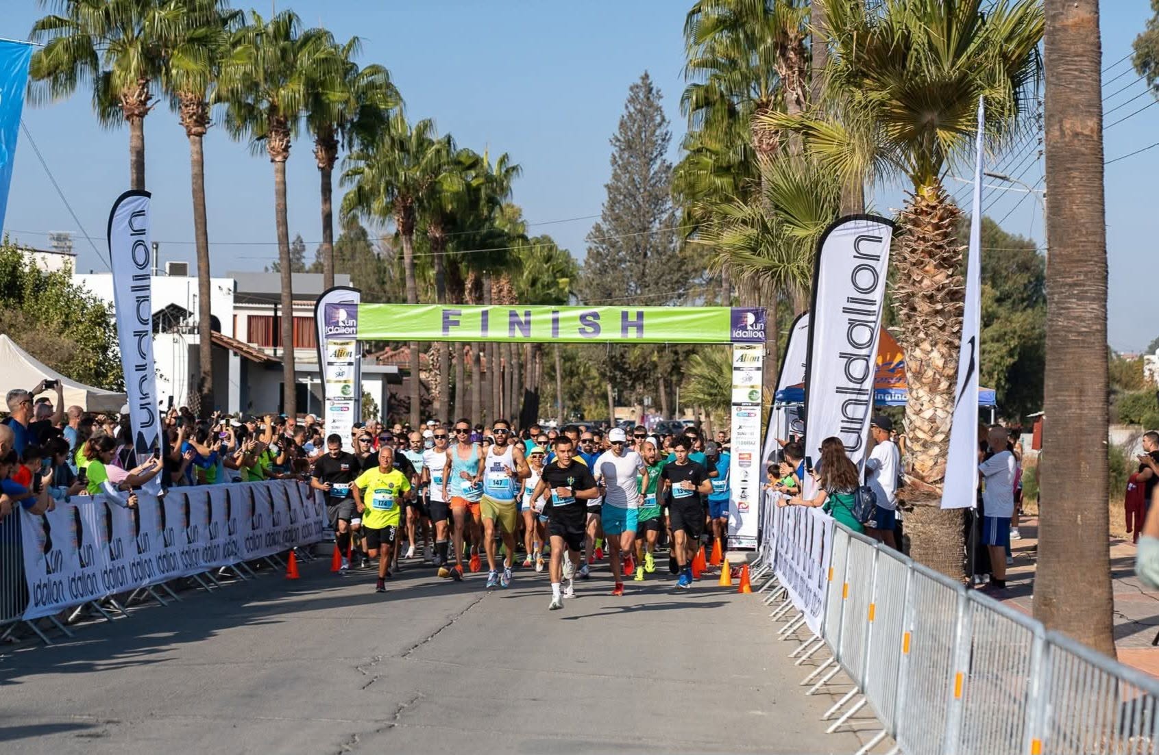 Runners crossing the start line at Run Idalion